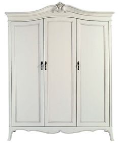 a white armoire with three doors and two drawers on the bottom, in front of a white background