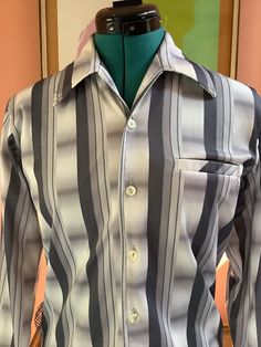 "70's Mens Nylon Gray Striped Shirt  Made by Delfina by Da Vicci Long sleeve button cuffs Button front with chest pocket  Ombré and stripped print Collar tabs in collar  Size S  Shoulders -17\" Sleeves -25\" Chest -41\" Waist -37\" Hip-36\" Length - 26 1/2\" Excellent vintage condition for its age (tiny pic on shoulder)" 70’s Dresses, Grey Striped Shirt, Jersey Boys, Beautiful Suit, Gray Shirt, Casual Stripes, Polyester Dress, Clothing Styles, Grey Shirt