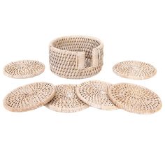 four wicker baskets sitting on top of each other in front of a white background