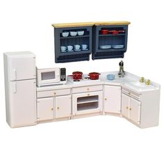 a toy kitchen with two cabinets and sink