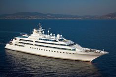 a large white boat floating on top of the ocean