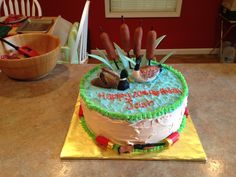 a decorated birthday cake with candles on top