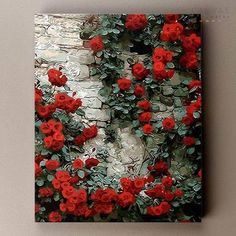 a painting of red roses on a brick wall