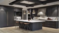 a large kitchen with black cabinets and white counter tops