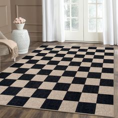 a black and white checkered rug in a living room