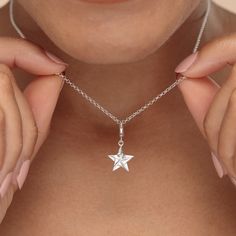 Give the gift of a lucky star with this sterling silver origami star charm necklace! This silver star charm has been crafted from recycled sterling silver and features smooth polished surfaces that reflects a high-quality shine. Inspired by the Japanese art of paper folding, known as origami, this 3d star has been designed to mimic folds of paper giving it a stunning geometric look.  All our charms attach with a clip-on clasp and are compatible with all other leading charm jewellery brands. Simp Elegant Silver Star Charm, Silver Star Charm For Everyday, Silver Star Sterling Silver Charms, Sterling Silver Star-shaped Charms, Silver Star-shaped Sterling Silver Charms, Silver Sterling Silver Star Charms, Sterling Silver Starfish Charm Necklace, Sterling Silver Star Charm Necklace For Everyday, Everyday Sterling Silver Star Charm Necklace