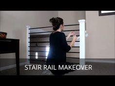 a woman standing in front of a white rail with the words stair rail makeover