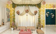 a living room decorated in gold and white with flowers on the walls, curtains, and couches