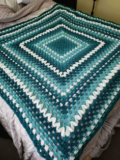 Handmade crochet throw with white detailing. This would make a lovely addition to anywhere you like to sit. This blanket is lightweight but holds in warmth. Size is 5ft by 5ft. Machine washable at any temperature. Teal Crochet Blanket Color Combos, Turquoise Crochet Blanket, Teal Crochet Blanket, Crochet Blanket Colors, Teal Crochet, Blanket Throws, Turquoise And Purple, Crochet Throw, Teal And Gold