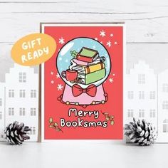 a christmas card with the words merry booksmas written on it and two pine cones next to it