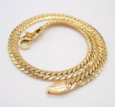 18k yellow gold cobra bracelet herringbone version 19.5 cm long 4 mm wide. Material: 750% 18 kt yellow gold Total Weight: 3.10 grams around Condition: New! Registered and insured Shipping Worldwide with carrier DHL, SDA, GLS, UPS, TNT, FedEx Dear visitor, for any questions or info or better 'proposal' of purchase, we are and I am always at your disposal! Many greetings from Italy! Lucio (collaborator of the Coa firm) Yellow Gold Plated Snake Chain Bracelet, Yellow Gold Snake Chain Bracelet, Formal Yellow Gold Snake Chain Bracelet, Flexible Yellow Gold Snake Chain Bracelet, Cobra Bracelet, Bones Bracelet, Italian Jewelry, Fish Bone, Chain Link Bracelet