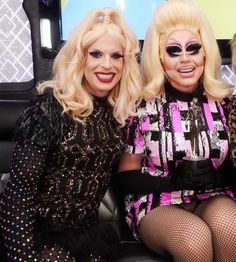 three women dressed up as drag queenes sitting next to each other