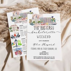 the wedding stationery is laid out on top of a bed with white sheets and fur