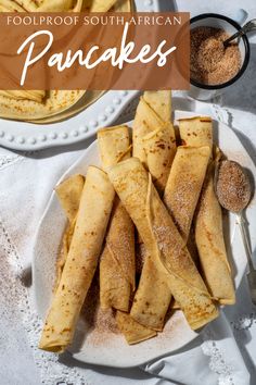 An oval plate of rolled up South African pancakes with cinnamon sugar. African Pancakes, Cinnamon Sugar Pancakes, Homemade Pancakes, Fluffy Pancakes, Fool Proof Recipes, Pancake Batter, Recipe Boards, Sweet And Savory