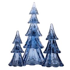 three blue glass christmas trees sitting next to each other