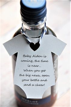 a baby bottle with a note attached to it