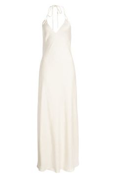 A full-length slipdress is designed with a halter neckline to create a night-out look of sweet simplicity that still makes a statement. Ties behind neck Halter neck Lined 100% polyester Dry clean Imported Spring Bias Cut Slip Dress For Wedding Night, Spring Bias-cut Slip Dress For Wedding Night, Elegant Bias Cut Halter Dress For Date Night, Spring Wedding Night Slip Dress With Bias Cut, Chic Solid Color Bias Cut Slip Dress, Summer Wedding Bias Cut Halter Dress, Halter Neck Bias Cut Slip Dress For Wedding, Wedding Slip Dress Halter Neck Bias Cut, Classic Bias Cut Slip Dress For Night Out