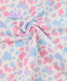 the fabric has hearts on it and is pink, blue, and white with polka dots