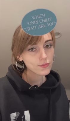 a woman with a funny hat on her head that says, which only child? treat are you?