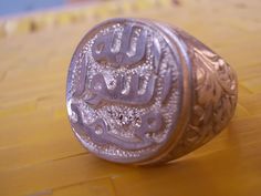 Religious Ring Prophet Mohammad Seal Allah Mohammad Rasool Real Sterling Silver Available in all sizes This ring is made with real precision and skill to give the look of the ancient Arabic words of Allah Mohammad Rasool. This ring is made in sterling silver 925 and polished with the latest polishing to avoid any scuffing. Please contact me in case of any questions. Traditional Carved Rings For Ceremonial Occasions, Traditional Carved Ceremonial Rings, Traditional Adjustable Engraved Ring, Traditional Adjustable Engraved Etched Ring, Traditional White Gold Engraved Ring With Polished Finish, Traditional Hallmarked Engraved Ceremonial Ring, Traditional Ceremonial Engraved Hallmarked Ring, Traditional White Gold Rings With Polished Finish, Adjustable Traditional Engraved Etched Ring