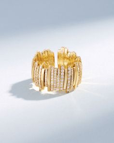 Experience timeless elegance with this Classic Gold Half Pave Milli Band, expertly crafted from 18-karat gold with pave white diamonds. This flexible ring features a unique design with meticulously strung pieces of yellow, white, or rose gold on an 18-karat gold spring wire, offering both comfort and sophistication. Details 18k yellow gold, rose gold or white gold 1.07 carats of pave white diamonds 12mm width Ref: BAR1073 Rainbow Sapphires, Suzanne Kalan, Tennis Necklace, Ruby Sapphire, Classic Gold, Fine Jewelry Collection, Ring Collections, White Diamonds, Diamond Wedding Bands