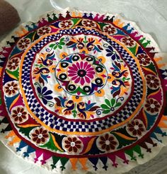 an artistically designed plate is sitting on the table