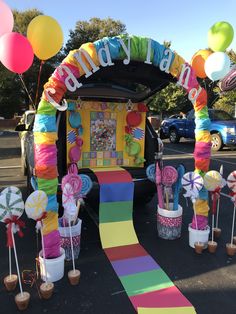 a car decorated with balloons and streamers