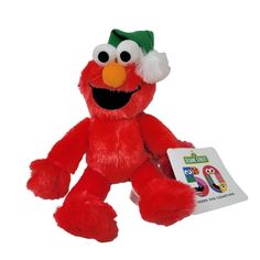 a red stuffed animal with a green hat