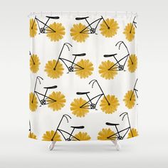 a shower curtain with yellow and black flowers on it, in front of a white background