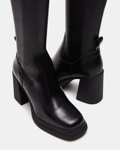 The ZENOVIA square toe knee boot is set on a wide outsole with a block heel, a comfortable base that makes this sleek and defined style super wearable. Block heel square toe knee boot Slip-on style with stretch fabric and a back pull loop 3.25 inch heel height 1 inch platform Size 6 measurements: 12 inch shaft circumference, 14.5 inch shaft height Size 8 measurements: 13.5 inch shaft circumference, 15 inch shaft height Size 10 measurements: 14 inch shaft circumference, 15.5 inch shaft height Veg Shoe Goals, Boots Steve Madden, Steve Madden Store, Apparel Merchandising, Leather Socks, Knee Boot, Summer 2025, Black Square, Platform Boots