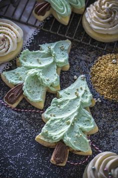 cookies decorated with frosting and christmas tree decorations