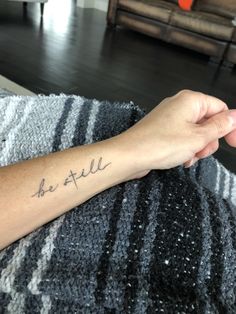 a person with a tattoo on their arm