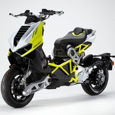 a yellow and black motorcycle is shown in this studio shot, with the front wheel facing forward