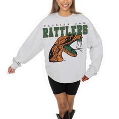 Cozy up on game day with this Florida A&M Rattlers Big Goals Relaxed Fit Sweatshirt from Gameday Couture. The lightweight French terry fabric provides a luxuriously soft feel, perfect for game day watch parties or casual outings. With its dropped shoulders and rounded droptail hem, this oversized sweatshirt offers a stylish and comfortable fit that's perfect for everyday wear. Fall Season Team Logo Sweatshirt, Collegiate Fall Fan Gear Tops, School Spirit Tops With Team Logo For Fall, Fall School Spirit Tops With Team Logo, Fan Apparel Top With Team Logo For Fall, Fan Apparel Tops With Team Logo For Fall, Fall Fan Apparel Top With Team Logo, Varsity Style Fan Merchandise Tops For Fall, Sporty Fan Merchandise Tops For Fall