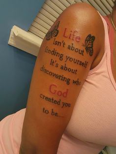 a woman with a tattoo on her arm saying life isn't about finding yourself it's about discovering who god created you to be