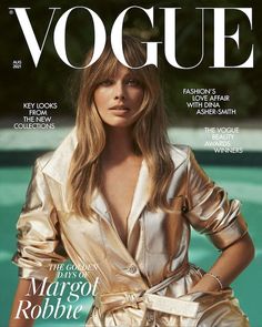 a magazine cover with a woman wearing a gold dress and jacket on the front page