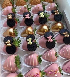 a box filled with chocolate covered strawberries and topped with minnie mouse ears on top