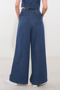 A striped denim pant featuring high waist, front closure, side pockets, contrasting belt and wide leg. Matching vest FJ1094 Details: Self : 100% Cotton Size & Fit - Model is 5`9" And Wearing Size Small- Measurements Taken From Size Small- Approx. Length: 42 1/2"- Approx. Inseam: 30" Striped Denim Jeans With Pockets, Striped Wide Leg Denim Jeans, Striped Wide-leg Denim Jeans, Striped Wide Leg Denim Pants, Straight Leg Denim Pants With Vertical Stripes, Striped Cotton Jeans With Pockets, Striped Wide-leg Denim Pants, Denim Wide Leg Bottoms With Vertical Stripes, Wide Leg Denim Bottoms With Vertical Stripes