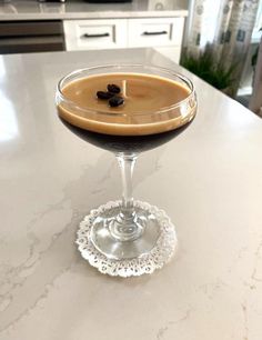 a drink sitting on top of a white counter