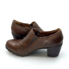 Experience comfort and style with BOC Born Concept Women's Leather Booties in size 41 Brown. Expertly crafted with a big solid heel, these pre-owned booties offer stability and effortless fashion. Perfect for any occasion, step out in confidence with BOC. Formal Brown Faux Leather Heeled Boots, Brown Faux Leather Shoes With Almond Toe, Brown Closed Toe Heeled Boots For Office, Brown Round Toe Heeled Boots For Business, Brown Faux Leather Boots With Stacked Heel, Brown Round Toe Office Boots, Brown Slip-on Faux Leather Boots, Brown Leather Sole Heeled Boots For Office, Vintage Brown Leather Heeled Boots With Round Toe