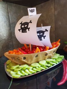 a pirate ship made out of vegetables on a table