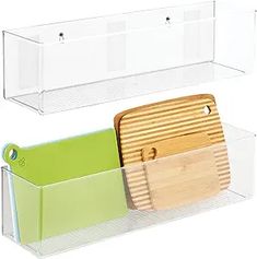 two plastic bins with wooden cutting boards in them and one holding chopping board