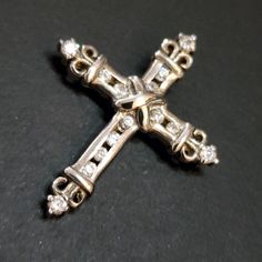 "This is a sterling silver cross pendant and is stamped \"925\" on the back. It has a sparkly clear CZs inlaid. Bail loop is on the back. The back of the pendant is flat other than the loop. CROSS SIZE 1.25 inches tall 1 inch wide This would make a great gift for wife, sister, mother, grandmother, daughter, husband, children, siblings, father, grandchildren, etc. My family acquired a large set of jewelry back in 2000 from a jewelry store that went out of business. These pendants are part of that Silver Diamond Cross Pendant Jewelry, Silver Crucifix Necklace For Formal Occasions, Formal Silver Crucifix Cross Necklace, Formal Sterling Silver Cross Necklace In Diamond White, Formal Silver Sterling Silver Cross Necklace, Formal Diamond White Sterling Silver Cross Necklace, Silver Cross Diamond Jewelry, Silver Diamond Cross Jewelry, Classic Silver Cross Pendant Necklace