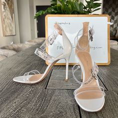 - Designer = Gianvito Rossi - Size = 9.5m(39.5). Trunk 30 - Color = White -4heel Height = Approximately 4.25” Inches - Measured On The Inside From Front Tip Of Open Toe To Back Tip Of Heel To Give An Estimate Of Size Length= Approximately 26.2cm. - Made In Italy - Genuine And Authentic Or Your Money 7back Trunk 30 Evening Sandals With Clear Strap And Pointed Toe, White High Heel Sandals With Clear Strap, Elegant Sandals With Transparent Straps And Open Heel, White Open Toe Heels With Clear Strap, Clear High Heel Sandals With Heel Strap, Clear Open Toe Heels With Heel Strap, Evening Clear Sandals With Transparent Straps, Chic Sandals With Translucent Outsole And Ankle Strap, Evening Sandals With Clear Strap And Open Heel