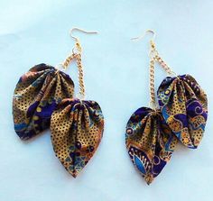 the earrings are made with fabric and gold chains