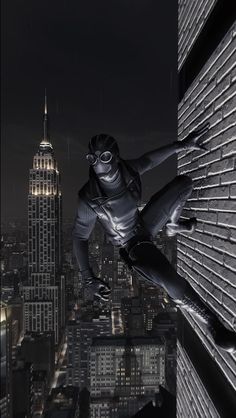 a black and white photo of a person on a skateboard in the city at night