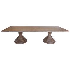 a wooden table with two pedestals on top