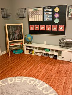 a child's room with a chalkboard and wooden floors