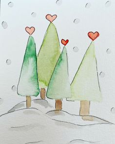 three trees in the snow with hearts on them