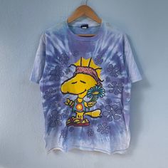 Details: *Vintage 90s distressed peanuts woodstock peace tiedye tshirt  *Measurements:  Size Large -Chest (armpit to armpit) : 22.5 inches / 57 cm -Length (collar to bottom hem) : 29.5 inches / 75 cm *Distressed condition 7/10. -Got holes at shoulder area -Got sign of stain Please refer image above thank you! ------------------------------------------ After purchase please leave phone number for shipping will ship using Fedex/DHL express  (Estimated to arrive 4-7 days only) If you have any questions regarding the item, feel free to contact any time. Customer satisfaction is our priority! Check out my other items & follow - new arrivals every day! https://kedainasvintage.etsy.com Tie Dye Hippie T-shirt For Spring, Vintage Tie Dye T-shirt For Summer, Spring Hippie Hand-dyed T-shirt, Tshirt Measurements, Peanuts Woodstock, Tie And Dye, Woodstock, Dhl Express, Phone Number